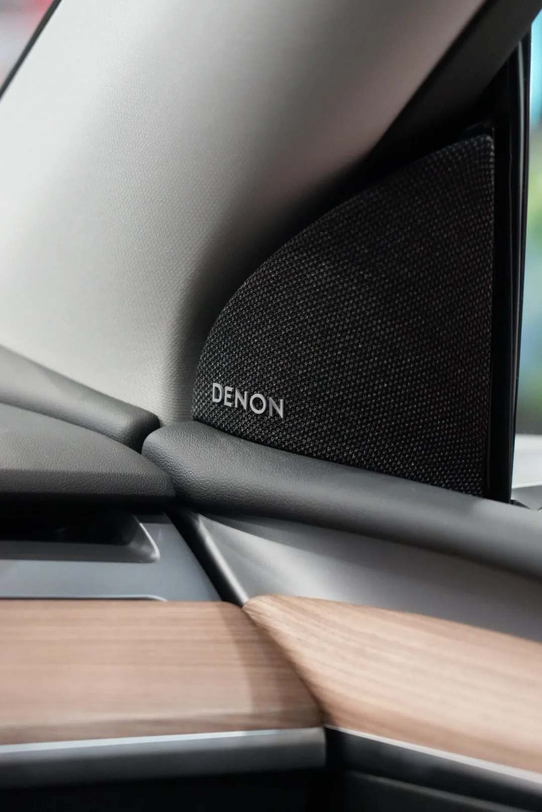 Denon speaker hardware installed in the demo car's A-pillar